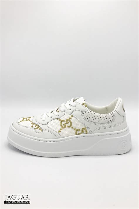 white and gold gucci sneakers